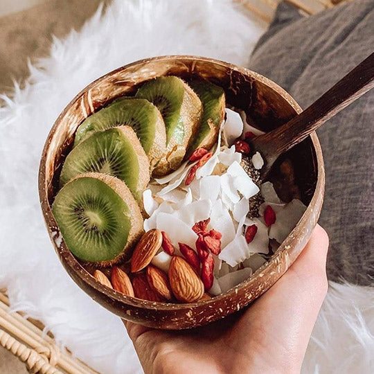 Holding a coconut bowl