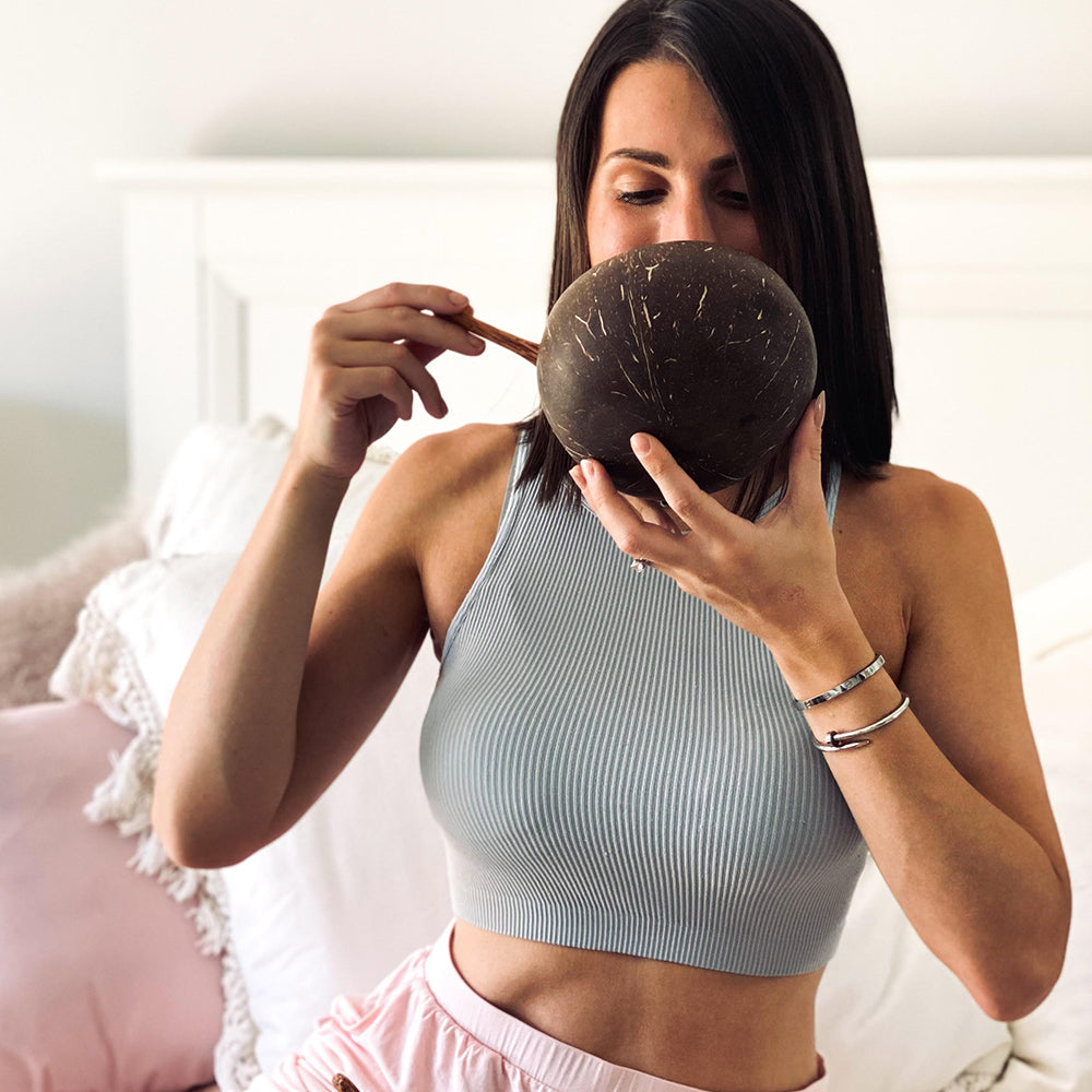 Enjoying a coconut bowl in the kitchen