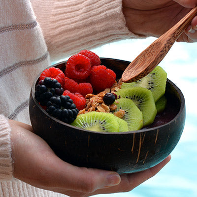 Acai bowl served in a coconut bowl