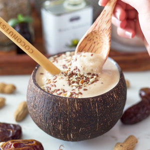Peanut butter smoothie in a coconut cup