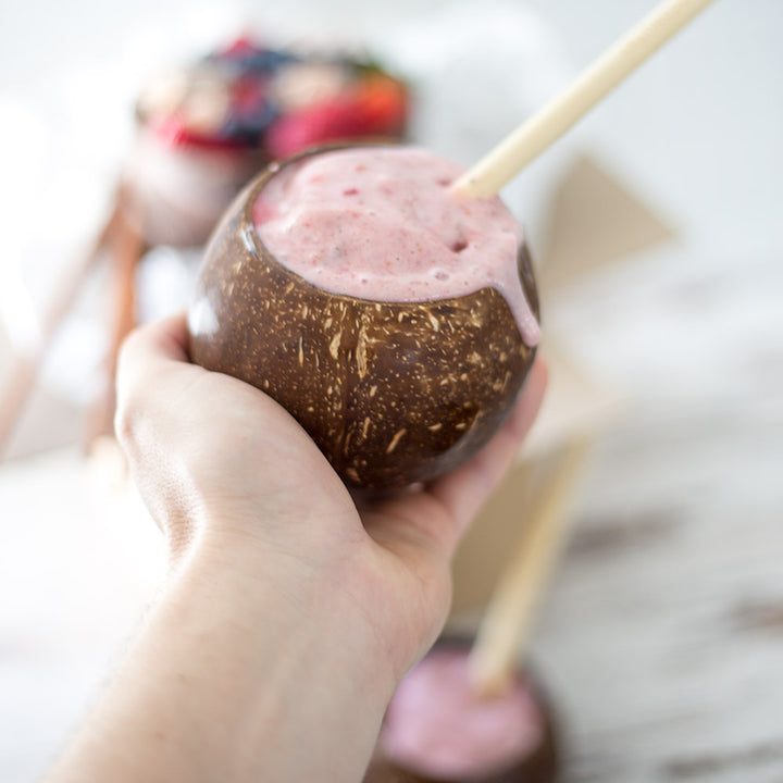 Strawberry smoothie in a coconut bowl