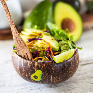 Avocado salad in a coconut bowl