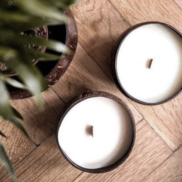 Coconut candles sitting on a table