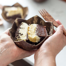 Load image into Gallery viewer, Eating cake from a coconut bowl
