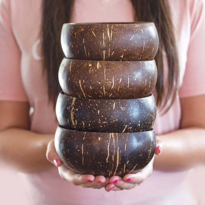 Holding a set of jumbo coconut bowls